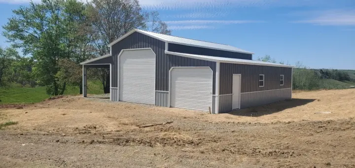Navy two-door garage with side carport